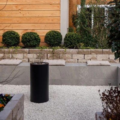 ScandiFlames Dualis bioethanol fireplace with a black fireplace body and a cylindrical safety glass