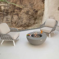 Ronde grijze bio-ethanol vuurtafel met bronzen glaskiezels en windscherm