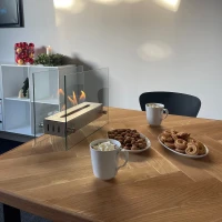 Tafel biohaard in glas met een stalen brander. Brandtijd: 2-3 uur. Maat: H: 28 x B: 35 x D: 12 cm