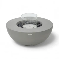 Ronde grijze bio-ethanol vuurtafel met bronzen glaskiezels en windscherm